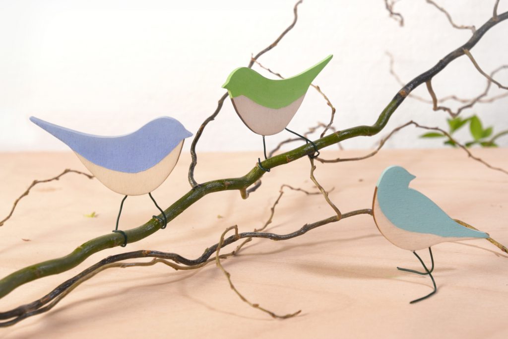 Colorful wooden birds made with a laser cutter